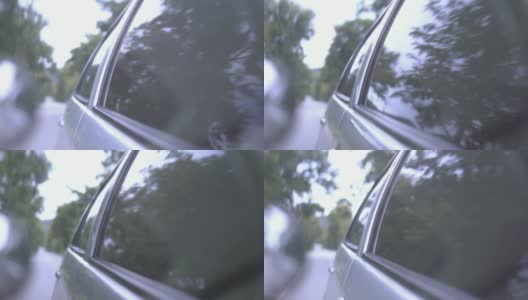 车窗上的倒影。汽车行驶的镜头，慢镜头高清在线视频素材下载