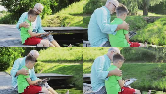 爷爷和孙子坐在码头上聊天高清在线视频素材下载