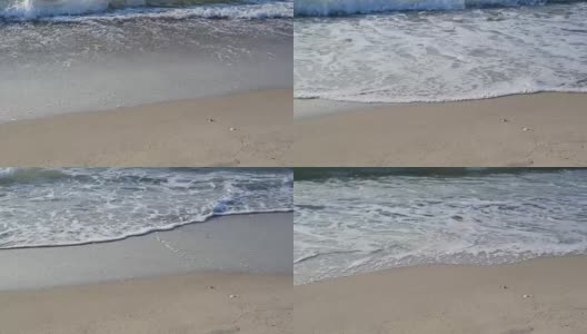 海浪拍打着海岸，拍打着沙滩高清在线视频素材下载