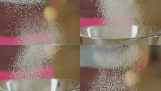 小麦粉与雪类似。面粉和筛子磨损。筛面粉高清在线视频素材下载