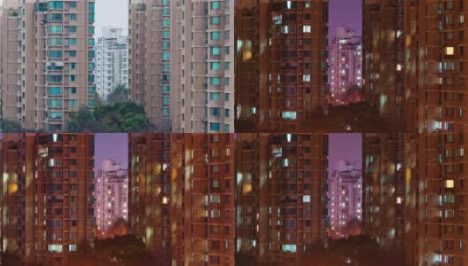 上海公寓楼白天到晚上的过渡时间流逝。中国拥挤的城市，夜晚灯火通明。在城市的大都市中，4k的时间间隔。高清在线视频素材下载