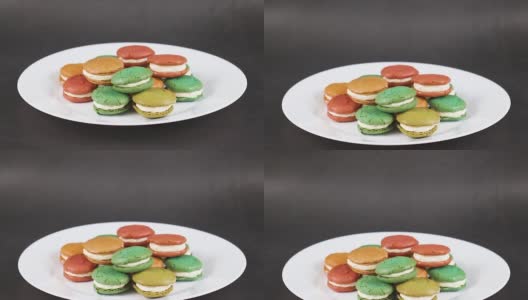 美味的彩色杏仁饼干放在白色的盘子里高清在线视频素材下载