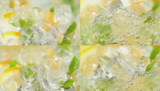 将水倒在冰块、柠檬片和薄荷上制作柠檬汁高清在线视频素材下载