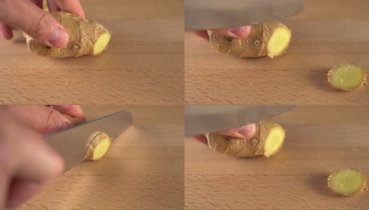 一名男子用刀将多汁的生姜切成块。在一块木板上。高清在线视频素材下载