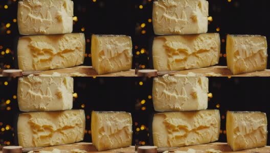 中等硬度的帕尔玛干酪头放在木板上。Dolly-in拍摄高清在线视频素材下载