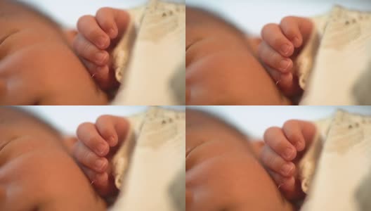 新生婴儿睡觉时把手收起来高清在线视频素材下载