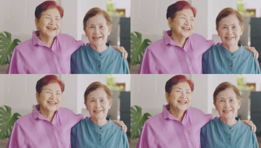 两位亚洲(泰国和中国)大姐面带爱心，对着镜头微笑，展现了她对幸福、自信、健康的退休家庭的积极享受。高清在线视频素材下载