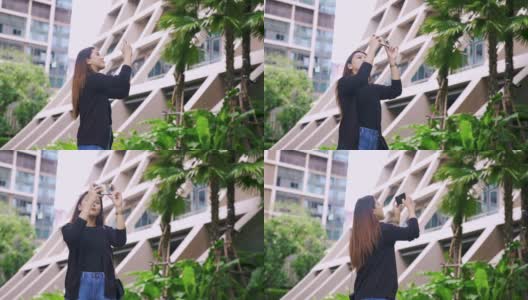一名亚洲女子在酒店拍摄一段视频。高清在线视频素材下载