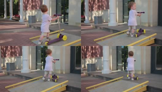 那孩子骑着滑板车在散步，高清在线视频素材下载