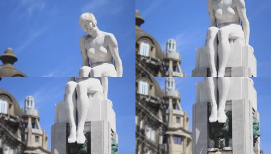 葡萄牙波尔图——2014年5月:在联盟大道(Avenida dos Aliados)，自由广场(Praca da Liberdade，自由广场)，坐在喷泉顶上的女人雕塑。高清在线视频素材下载
