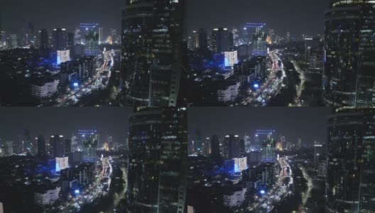 现代化的办公大楼景观和夜间交通高清在线视频素材下载