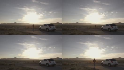 沙漠里的破车人高清在线视频素材下载