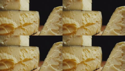 中等硬度的帕尔玛干酪头放在木板上。Dolly-out拍摄高清在线视频素材下载