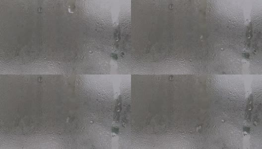 水滴凝结在雾蒙蒙的玻璃窗上高清在线视频素材下载