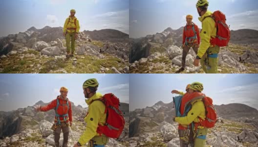 两个男性登山朋友在阳光下到达山顶时拥抱在一起高清在线视频素材下载