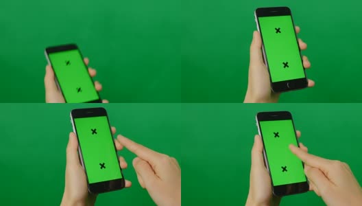 女商人用绿色背景的空白绿色屏幕手机。高清在线视频素材下载