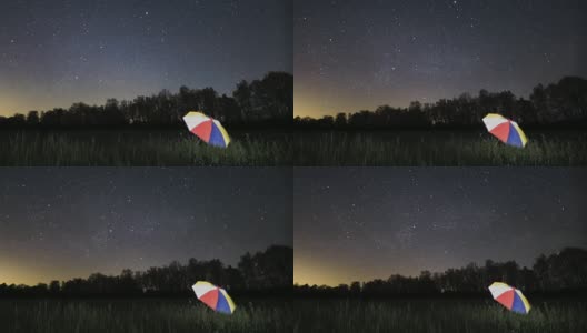 时间流逝流星雨在伞在野外高清在线视频素材下载