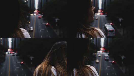 近距离观看年轻的黑发女性站在桥上，看着交通道路在纽约，美国高清在线视频素材下载