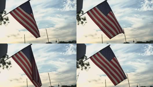 小镇日落中飘扬的美国国旗(60帧/秒)高清在线视频素材下载