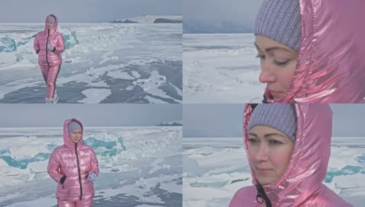 一个女孩走在贝加尔湖破裂的冰面上。一名女旅行者探索并看着一块浮冰。这是自然界中最神奇最纯净的地方。冰环绕着旅行者所有的旅程。高清在线视频素材下载