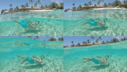 半水下:快乐的年轻人浮潜在令人窒息的清澈海水中。高清在线视频素材下载