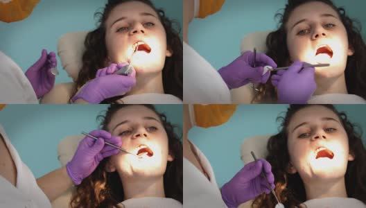 牙医在牙科医生那里检查病人的牙齿高清在线视频素材下载