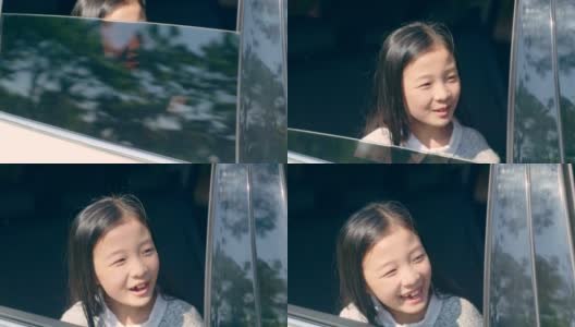 一个亚洲小女孩从汽车后窗往外看高清在线视频素材下载