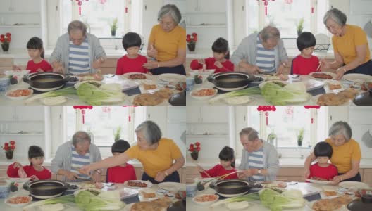 爷爷奶奶在孩子的帮助下准备年夜饭高清在线视频素材下载