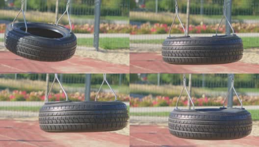 用公园里的轮胎做的空秋千，4K慢镜头，60帧高清在线视频素材下载