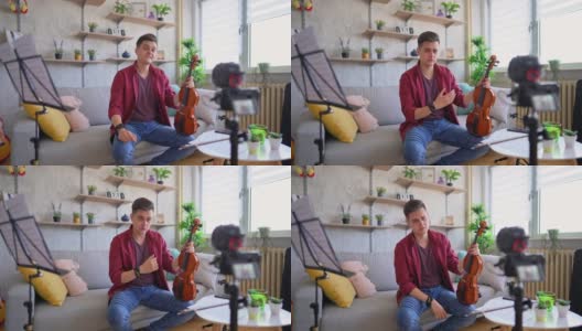 音乐家正在制作一个关于小提琴的视频博客高清在线视频素材下载