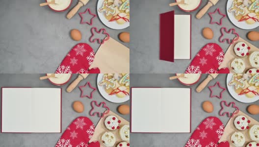 打开红色的书出现在桌子上的圣诞饼干和烘焙材料。停止运动高清在线视频素材下载