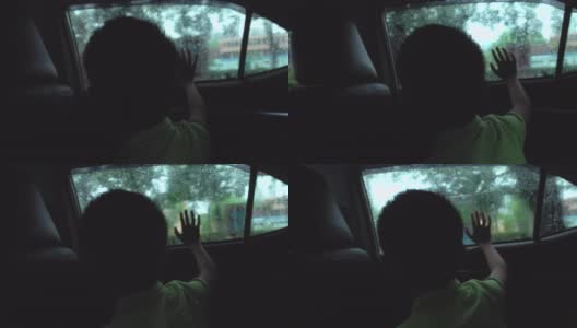 坐在车里看外面的亚洲男孩高清在线视频素材下载