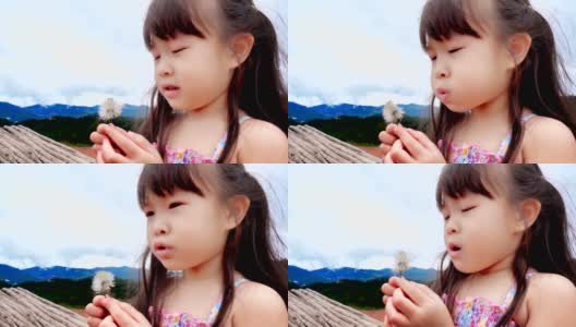 little girl blowing flower slow motion高清在线视频素材下载