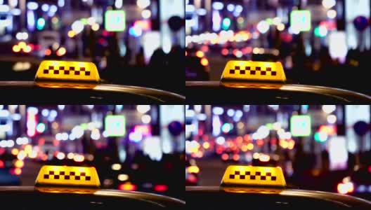 出租车标志后的城市交通在夜间的时间高清在线视频素材下载