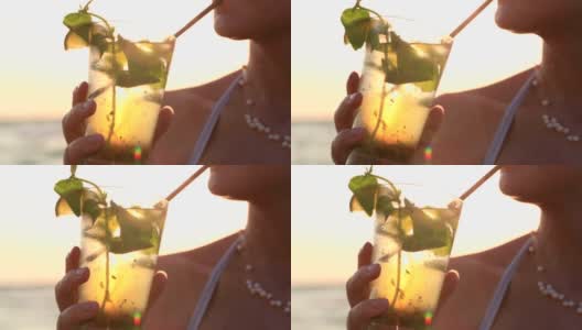 享用热带莫吉托鸡尾酒的女人高清在线视频素材下载