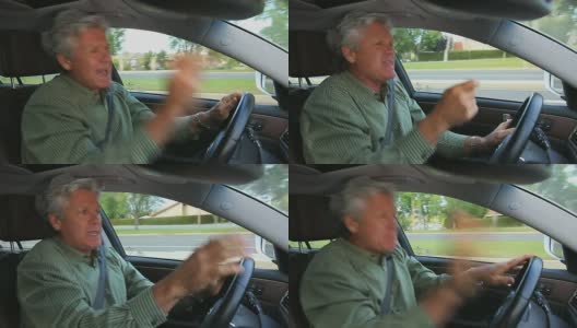 一名男子在开车时“摇滚”高清在线视频素材下载
