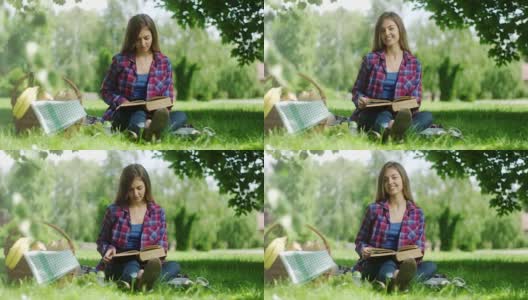 在大自然中阅读野餐书籍的女人高清在线视频素材下载