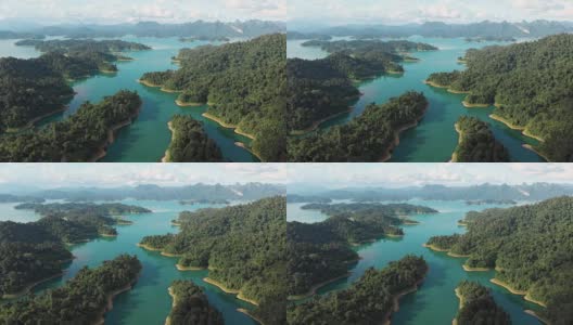 4k鸟瞰图和放大热带雨林在Chiaw Lan水坝在考索。高清在线视频素材下载