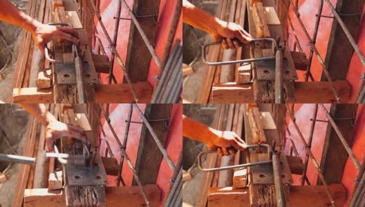 钢铁工人手工弯曲铁棒高清在线视频素材下载