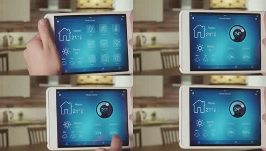 使用数字平板电脑上的应用程序控制室内温度高清在线视频素材下载