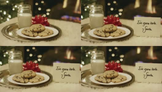 生酮圣诞:圣诞老人在壁炉旁放上“我生酮了”的纸条，礼貌地拒绝牛奶和饼干的镜头高清在线视频素材下载