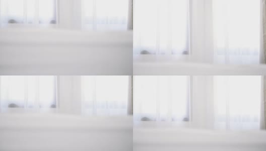 白色的室内，白色背景的窗帘和床上用品的窗户高清在线视频素材下载