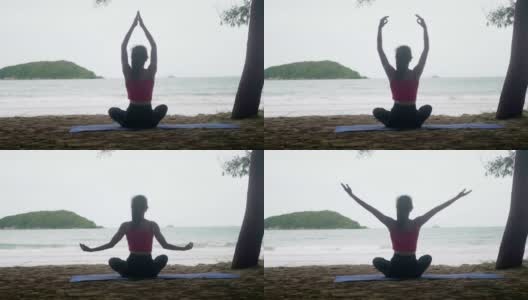 亚洲女人看海练练瑜伽，在沙滩上冥想柔韧平衡，瑜伽坐半莲花运动，健康积极的生活方式理念高清在线视频素材下载