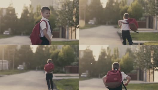 跟踪，慢动作:一个男生放学后跑回家。他身后是一个书包。高清在线视频素材下载