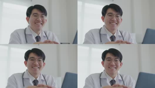 肖像大头照快乐微笑亚洲男子医生医务工作者。高清在线视频素材下载
