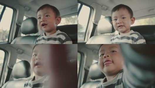 亚洲小男孩乘坐家庭汽车旅行高清在线视频素材下载