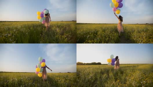 穿着礼服的女人在夕阳下走在草地上，手里拿着气球高清在线视频素材下载