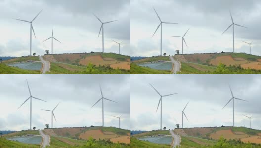 美丽的风力涡轮机与农业领域。农村玉米田可再生能源生产的概念高清在线视频素材下载