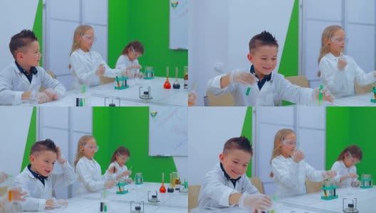 化学课上的孩子们。小学化学课-化学实验。高清在线视频素材下载