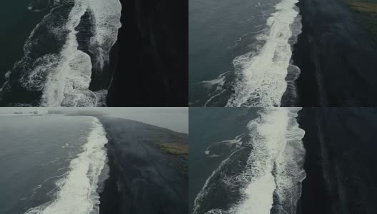 在冰岛的黑色火山海滩上海浪来海岸的Aeial视图。背景上的山高清在线视频素材下载